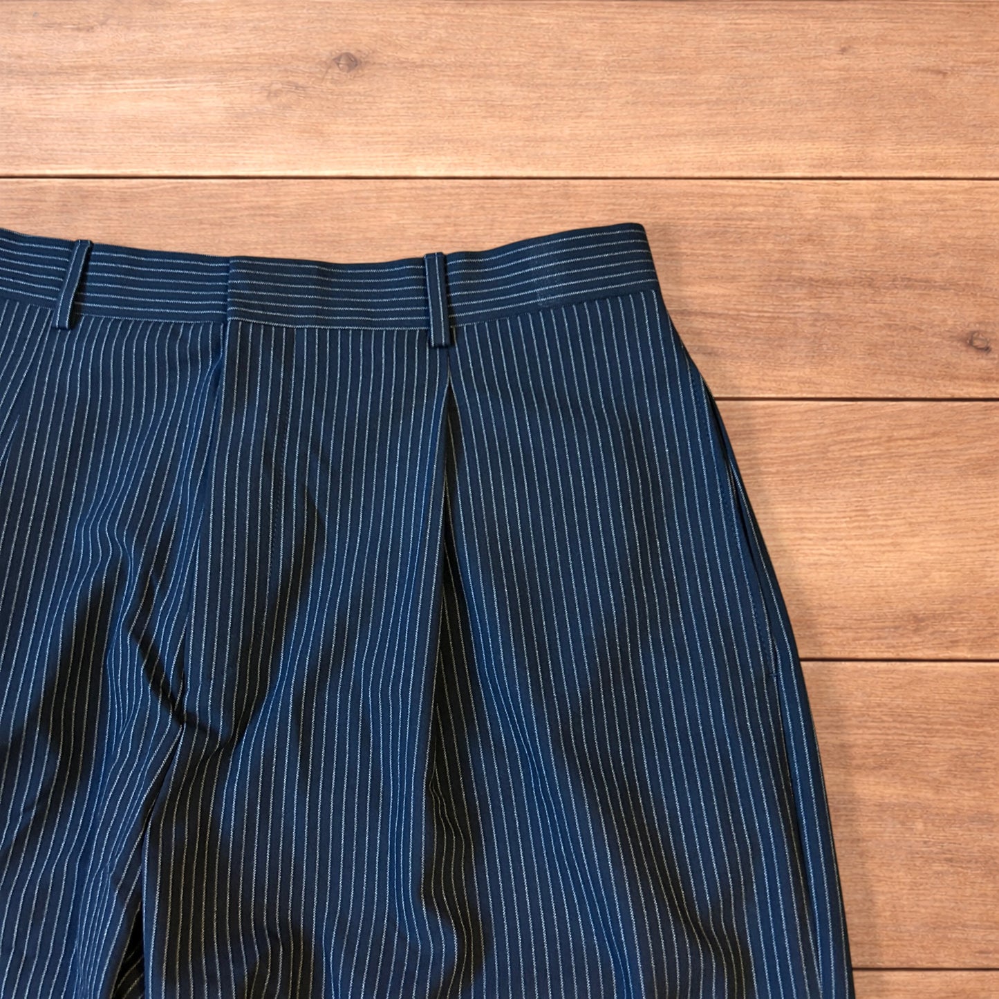 Vintage style baggy wide leg pinstripe tailored trousers in navy blue.
