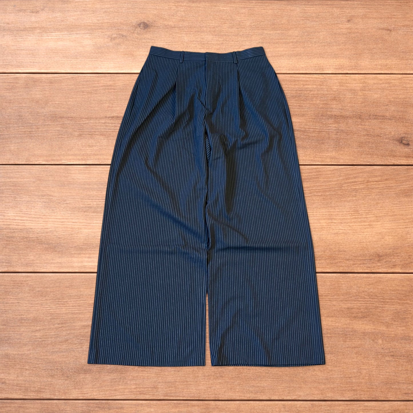 Vintage style baggy wide leg pinstripe tailored trousers in navy blue.