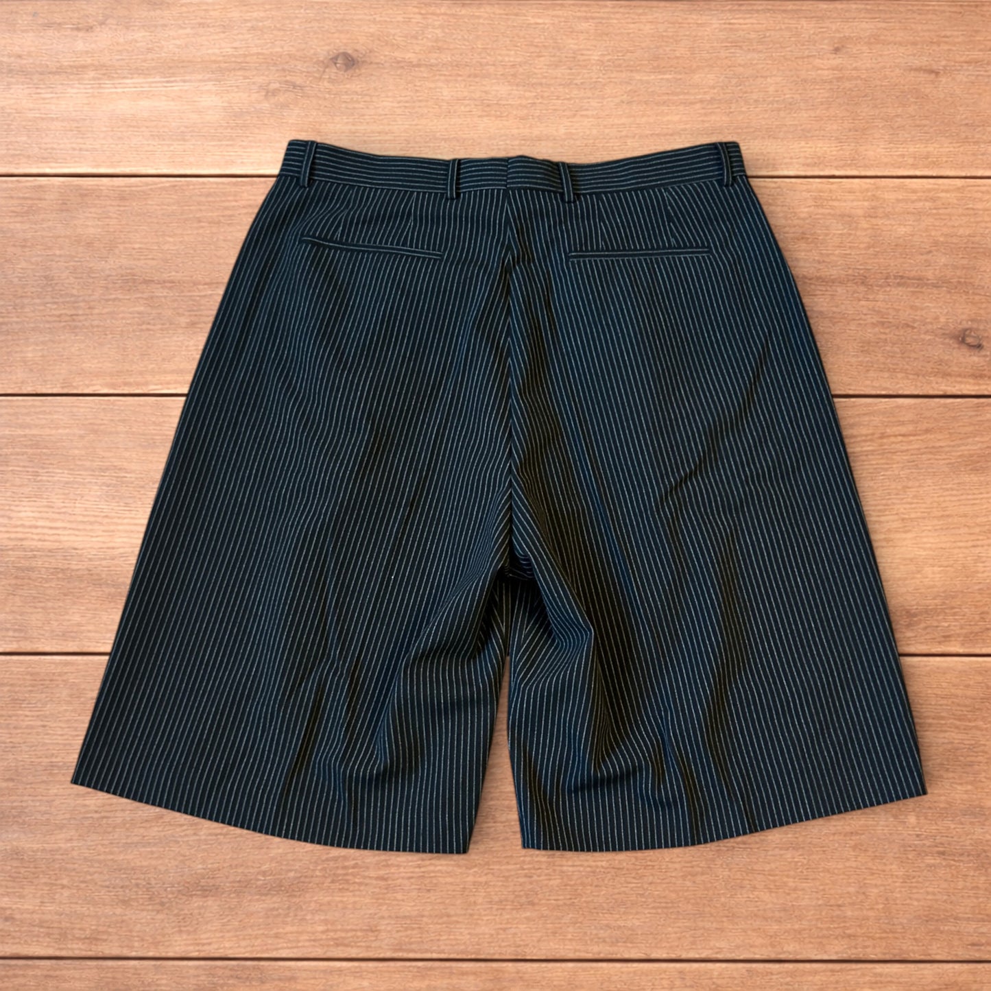 Vintage style baggy wide leg pinstripe tailored shorts jorts in black.