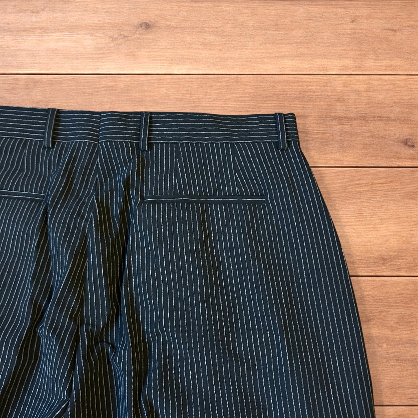 Vintage style baggy wide leg pinstripe tailored trousers in black.