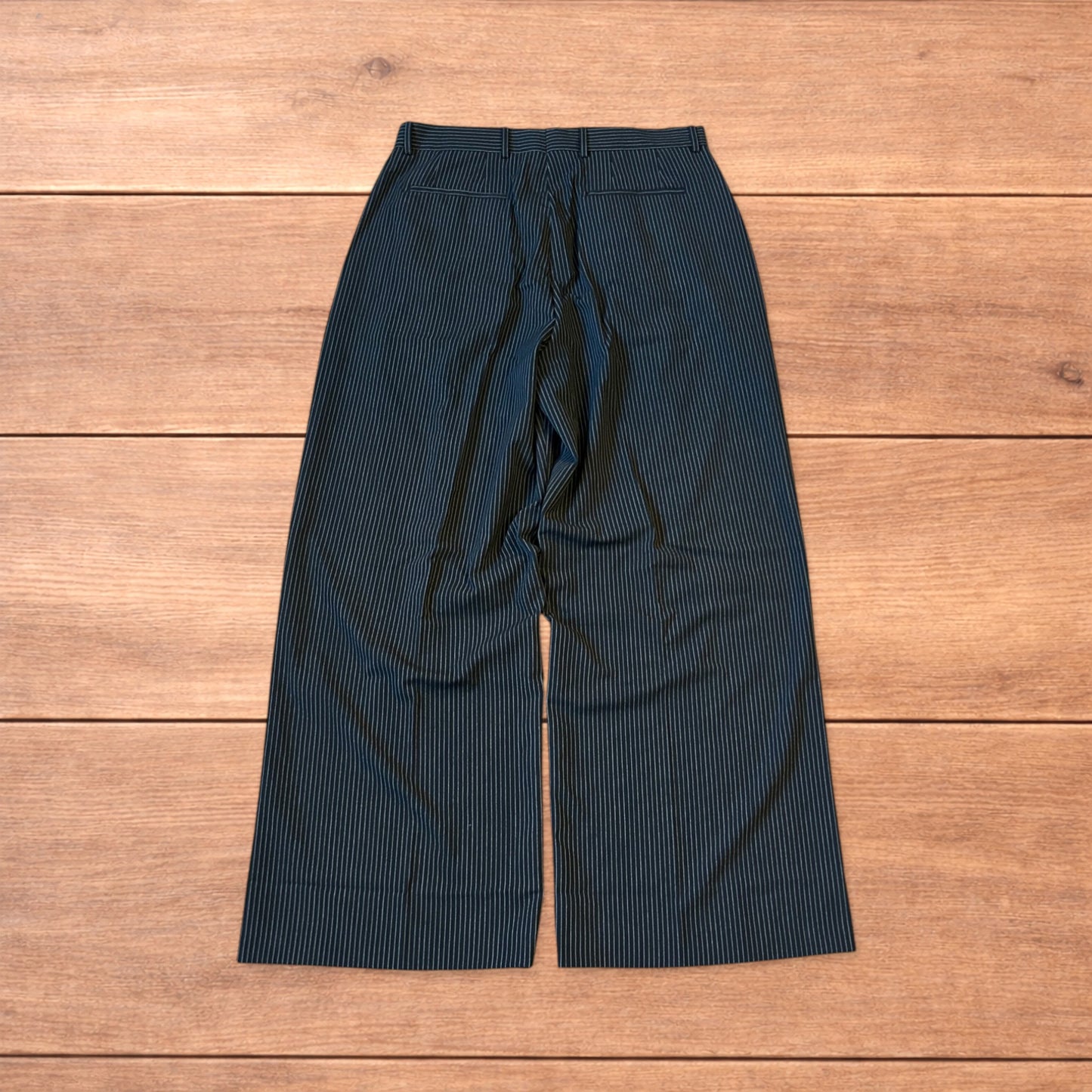 Vintage style baggy wide leg pinstripe tailored trousers in black.