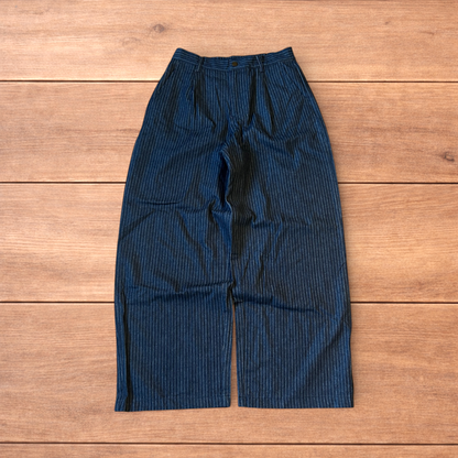 Vintage style baggy wide leg pleated twill pinstripe trousers in navy blue.