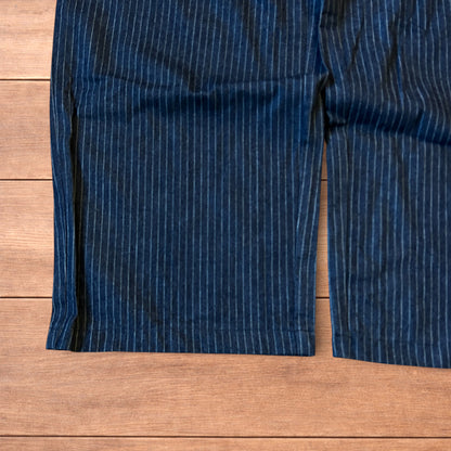 Vintage style baggy wide leg pleated twill pinstripe trousers in navy blue.