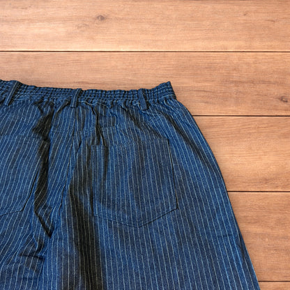 Vintage style baggy wide leg pleated twill pinstripe trousers in navy blue.