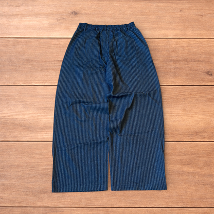Vintage style baggy wide leg pleated twill pinstripe trousers in navy blue.