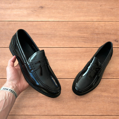 Lovely faux leather penny dress loafers shoes in black.
