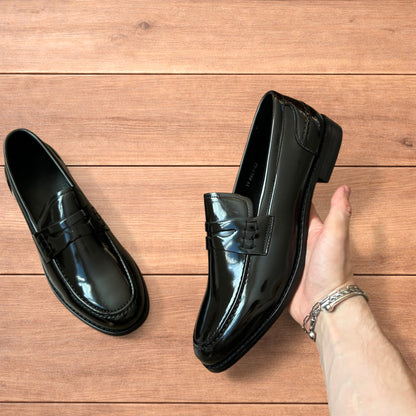 Lovely faux leather penny dress loafers shoes in black.