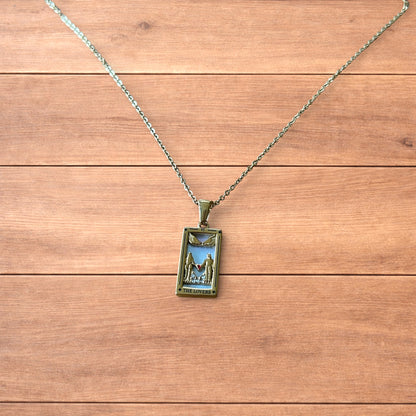 Gold stainless steel pendant necklace with The Lovers tarot card design featuring a couple holding hands and a heart detail.