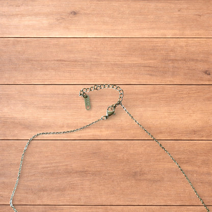 Gold stainless steel pendant necklace with The Lovers tarot card design featuring a couple holding hands and a heart detail.
