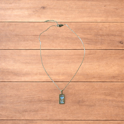 Gold stainless steel pendant necklace with The Lovers tarot card design featuring a couple holding hands and a heart detail.