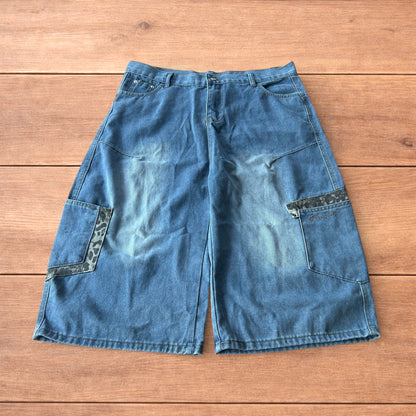 Vintage style baggy wide leg skater fit jorts shorts with leopard print in mid blue.