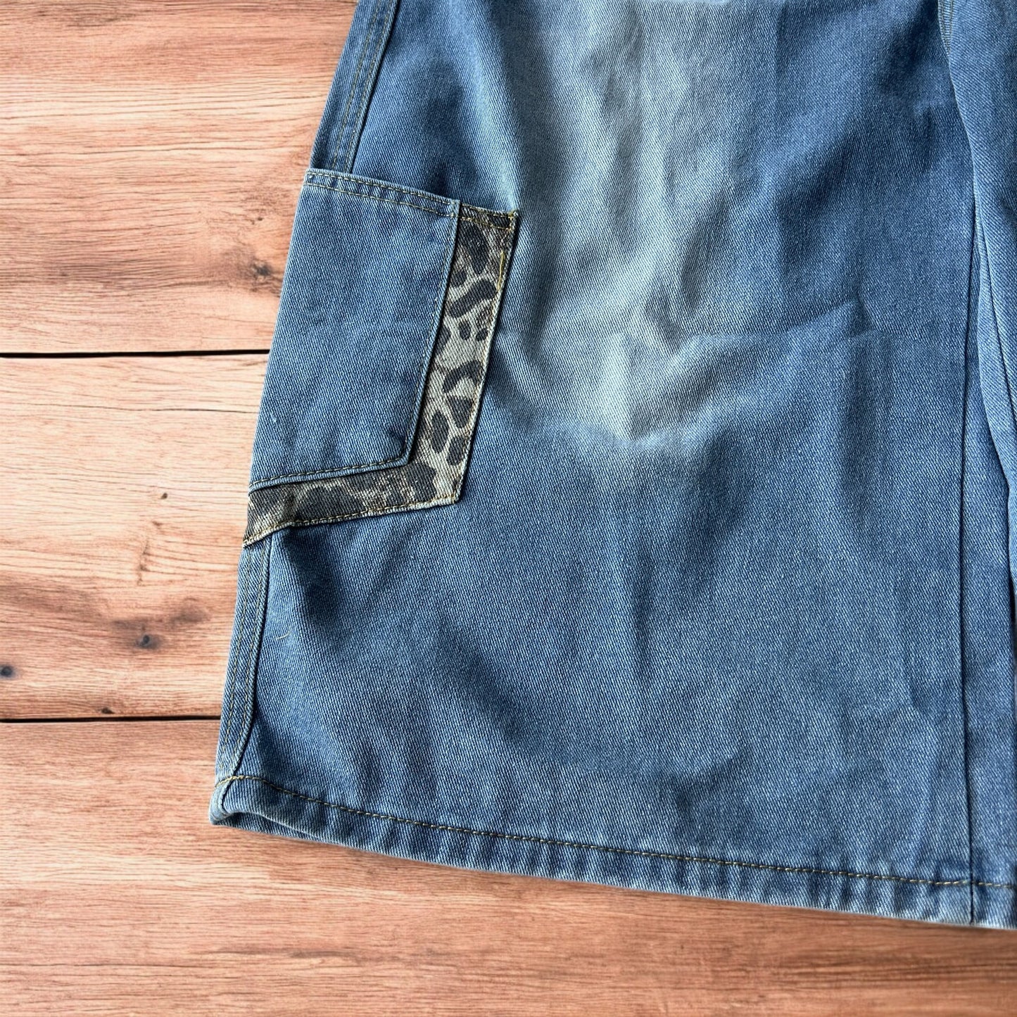 Vintage style baggy wide leg skater fit jorts shorts with leopard print in mid blue.