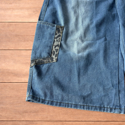 Vintage style baggy wide leg skater fit jorts shorts with leopard print in mid blue.