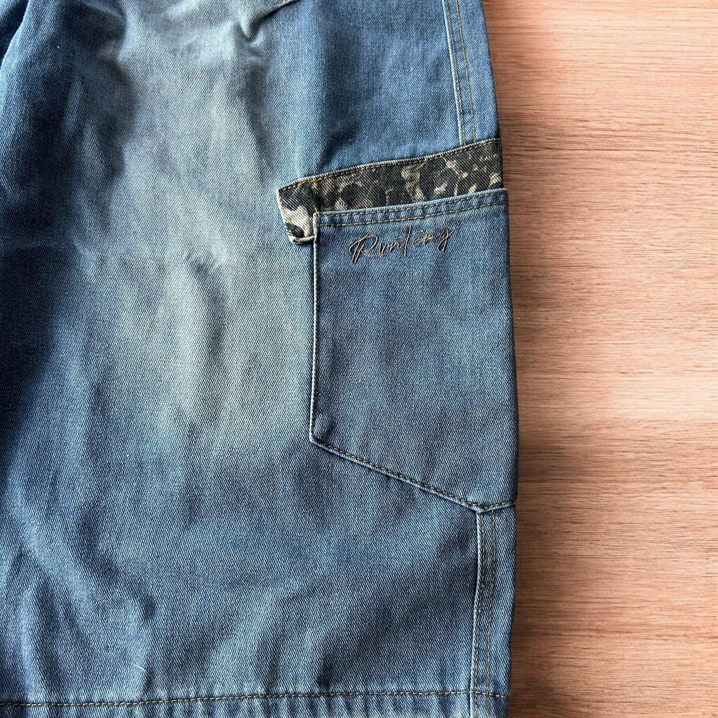 Vintage style baggy wide leg skater fit jorts shorts with leopard print in mid blue.