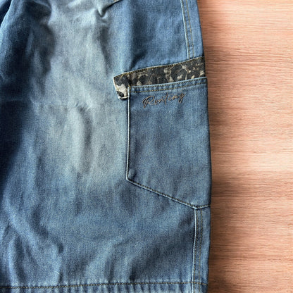 Vintage style baggy wide leg skater fit jorts shorts with leopard print in mid blue.