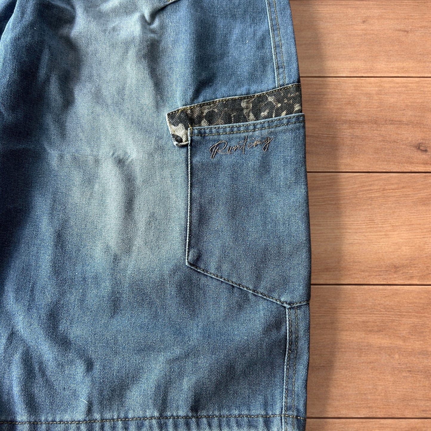 Vintage style baggy wide leg skater fit jorts shorts with leopard print in mid blue.