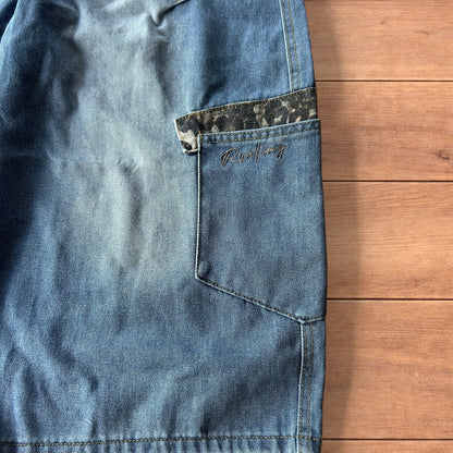 Vintage style baggy wide leg skater fit jorts shorts with leopard print in mid blue.