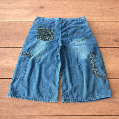 Vintage style baggy wide leg skater fit jorts shorts with leopard print in mid blue.