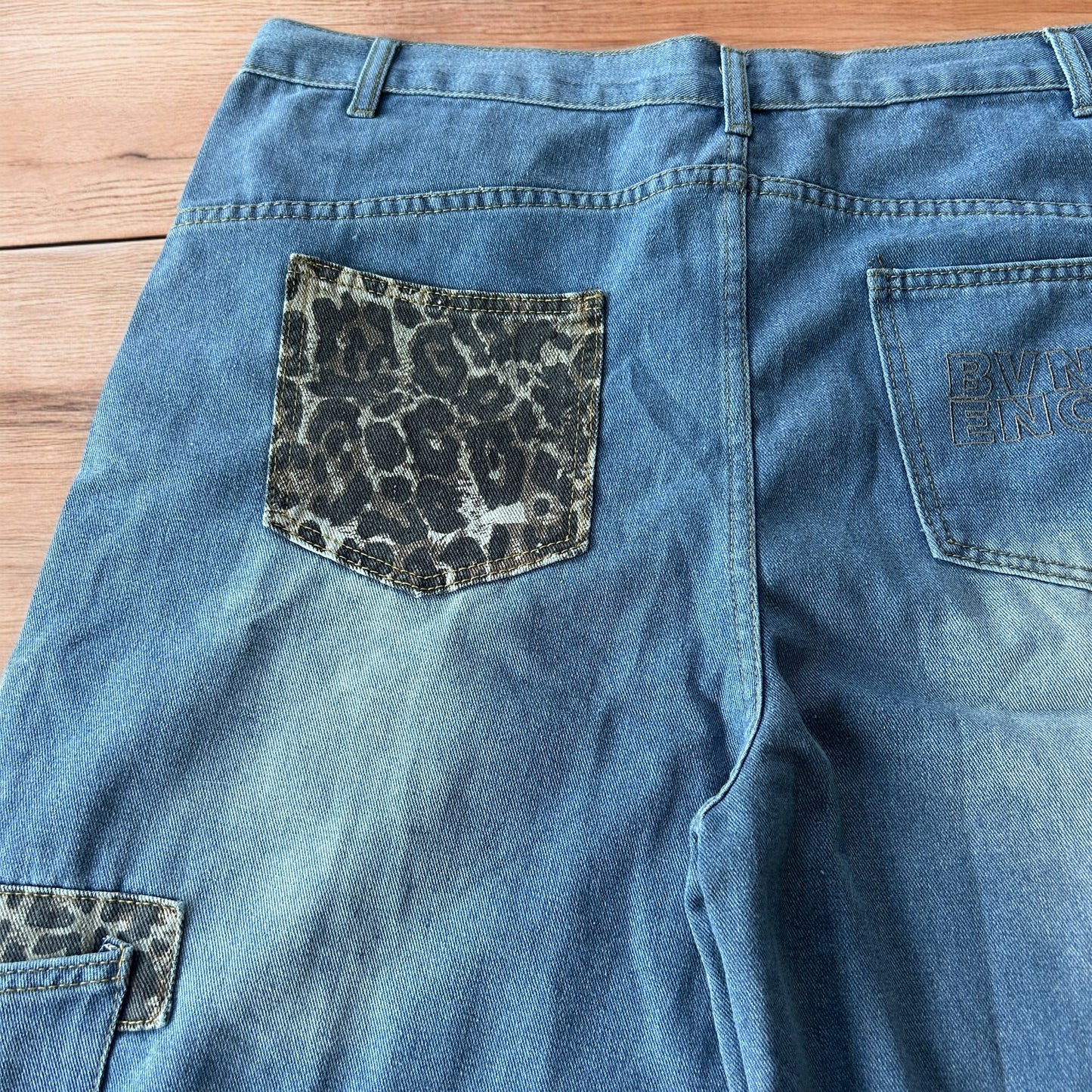 Vintage style baggy wide leg skater fit jorts shorts with leopard print in mid blue.
