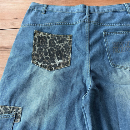 Vintage style baggy wide leg skater fit jorts shorts with leopard print in mid blue.