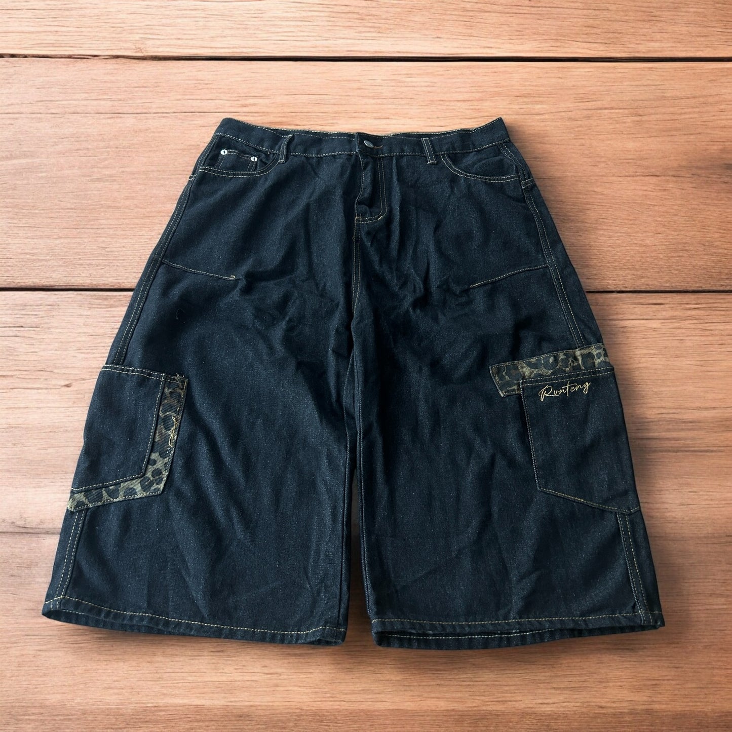 Vintage style baggy wide skater jorts shorts with leopard print in black.