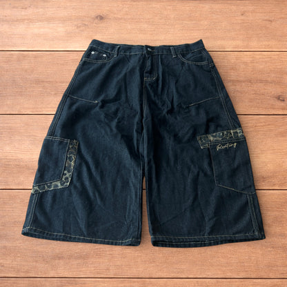 Vintage style baggy wide skater jorts shorts with leopard print in black.