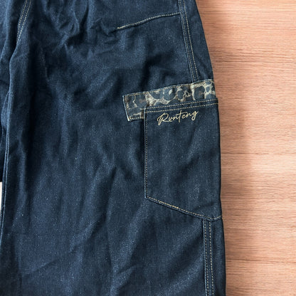 Vintage style baggy wide skater jorts shorts with leopard print in black.