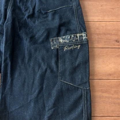 Vintage style baggy wide skater jorts shorts with leopard print in black.