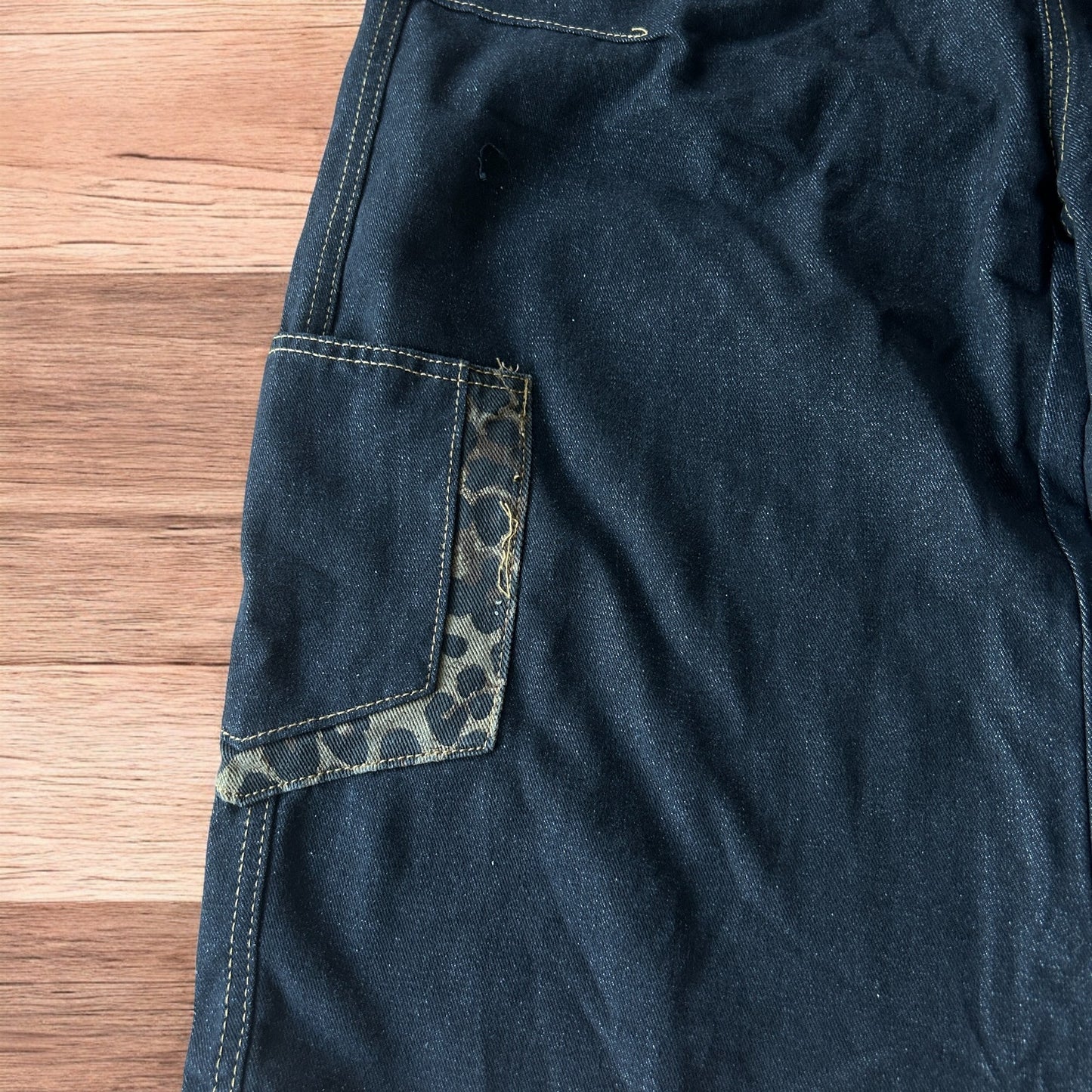 Vintage style baggy wide skater jorts shorts with leopard print in black.