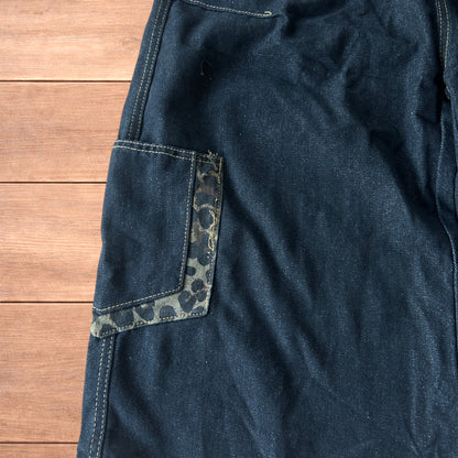 Vintage style baggy wide skater jorts shorts with leopard print in black.