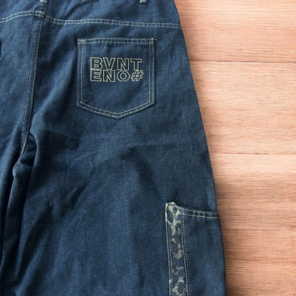 Vintage style baggy wide skater jorts shorts with leopard print in black.