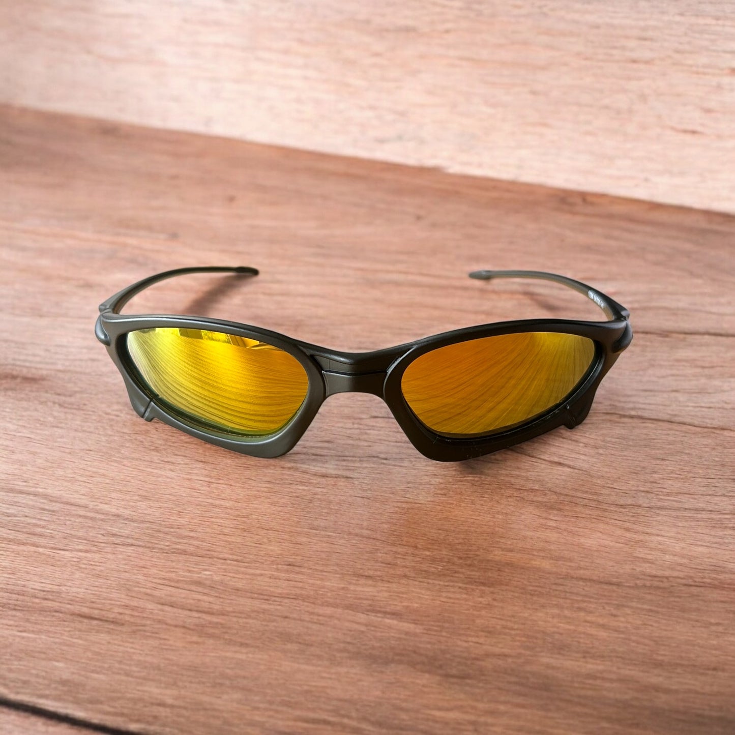 Insane polarised sunglasses in black with orange reflective lense. One size.