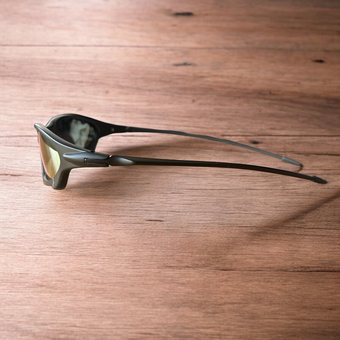 Insane polarised sunglasses in black with orange reflective lense. One size.