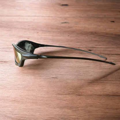 Insane polarised sunglasses in black with orange reflective lense. One size.