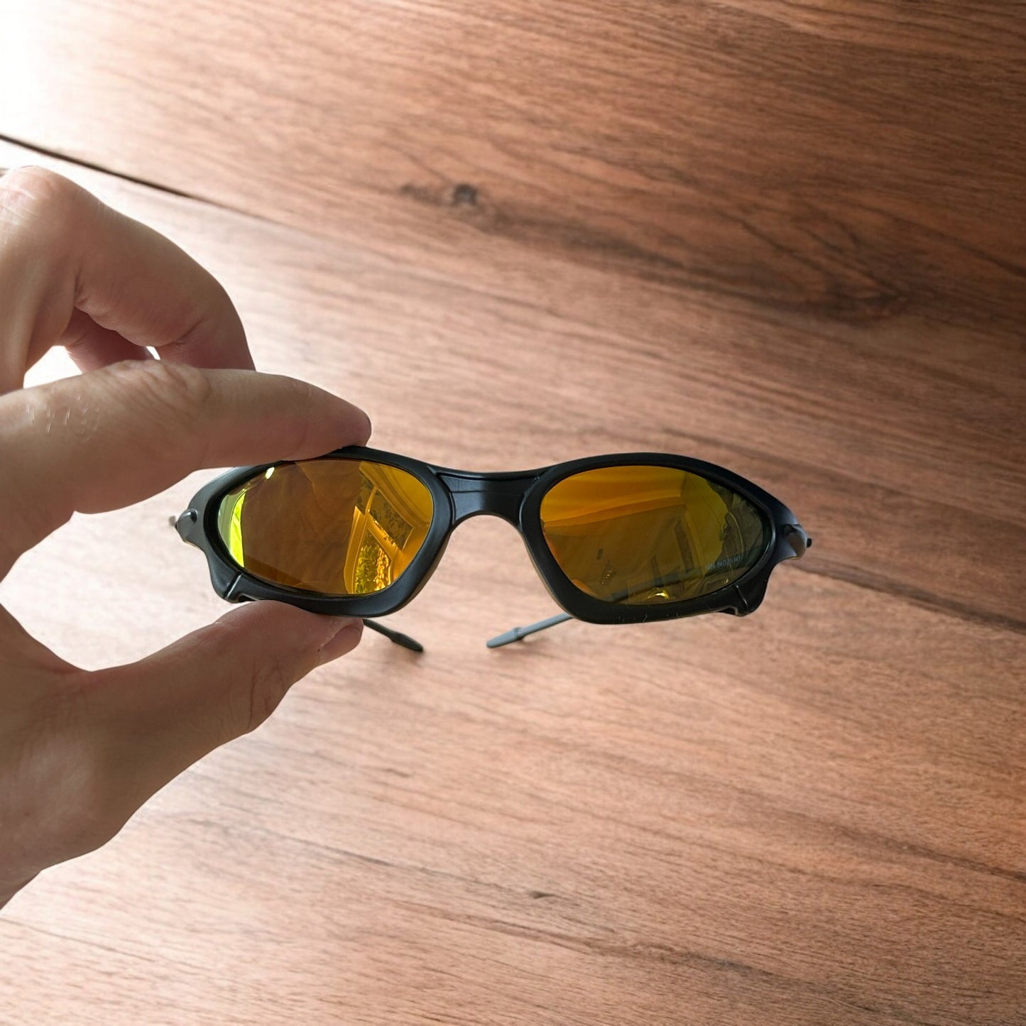 Insane polarised sunglasses in black with orange reflective lense. One size.