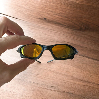 Insane polarised sunglasses in black with orange reflective lense. One size.