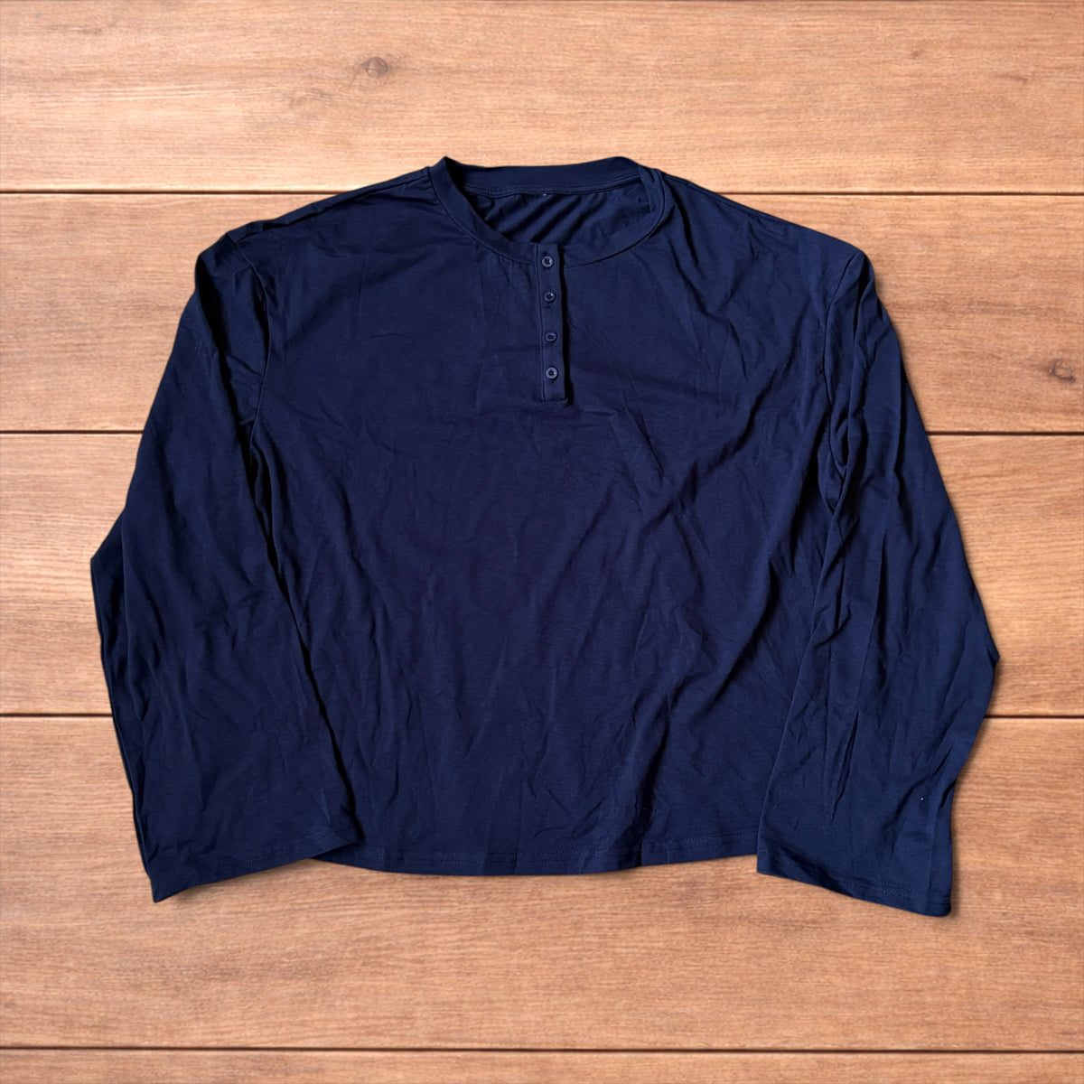 Relaxed fit henley long sleeve top in navy blue.