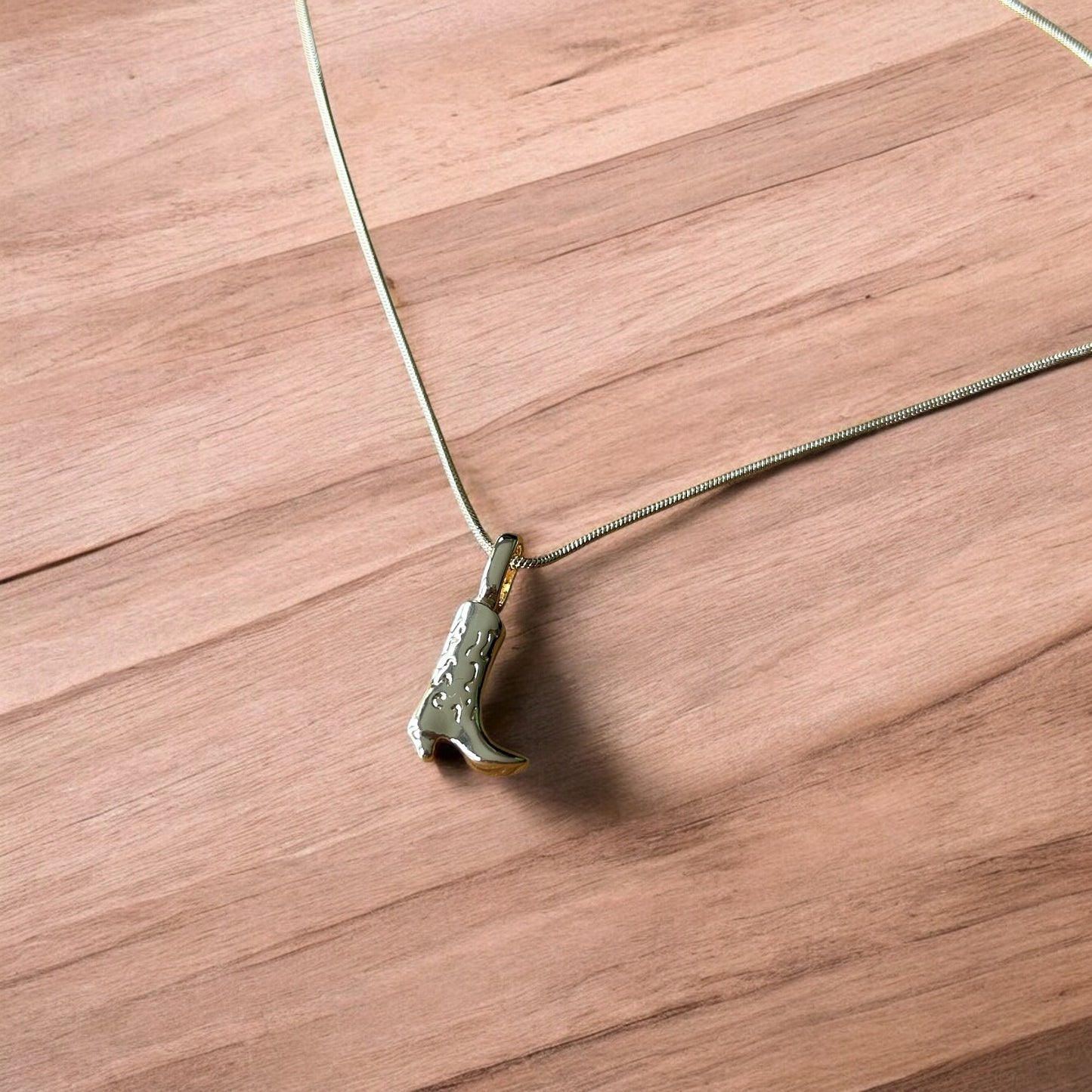 Lovely stainless steel necklace of cowboy cowgirl western boot in gold.