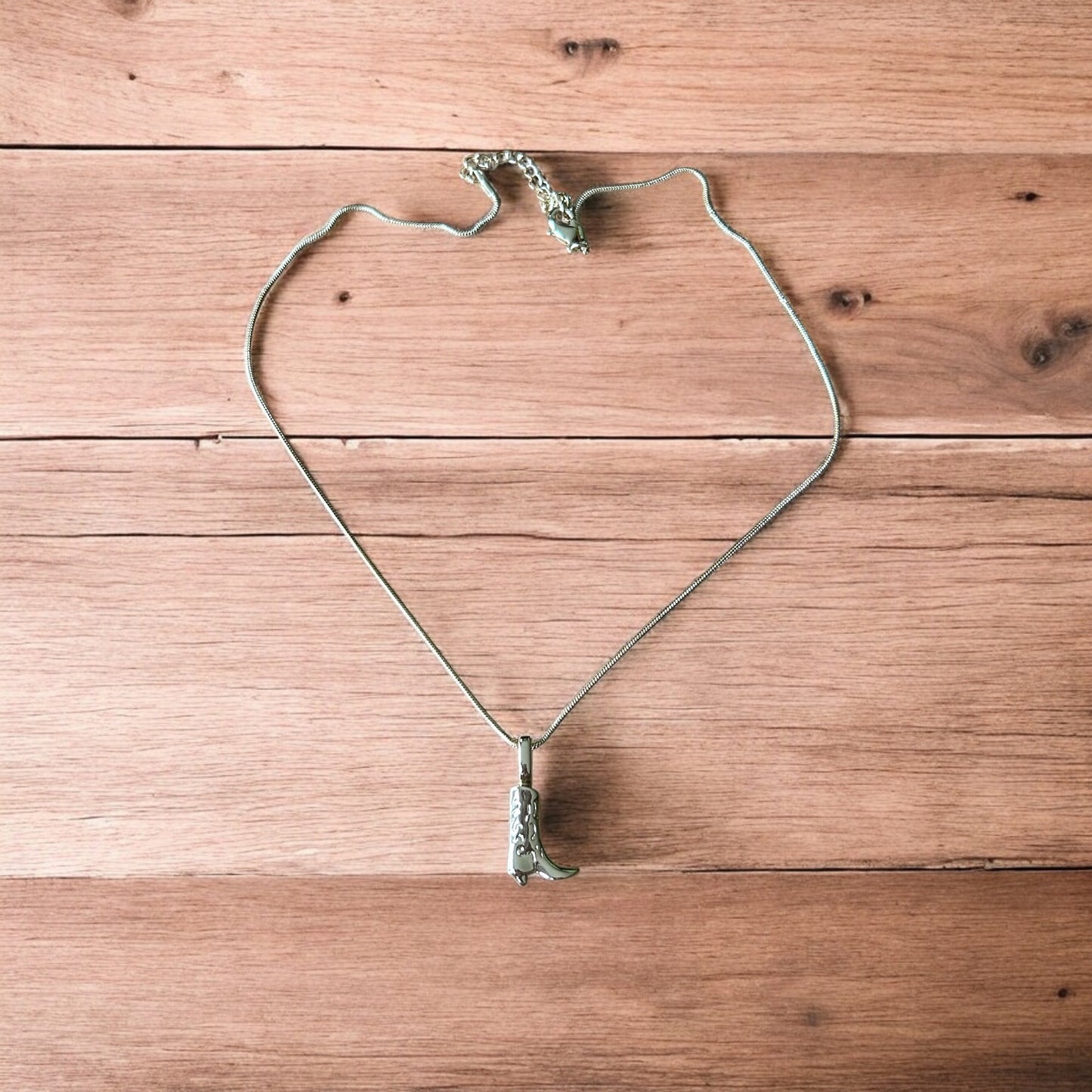 Lovely stainless steel necklace of cowboy cowgirl western boot in gold.