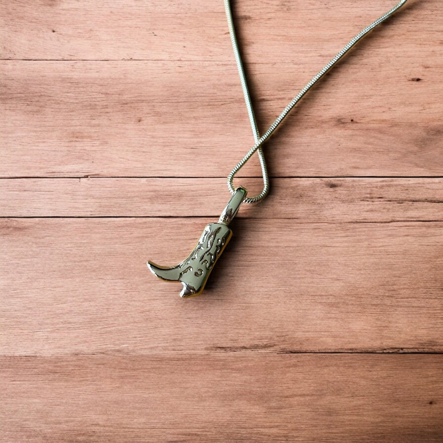 Lovely stainless steel necklace of cowboy cowgirl western boot in gold.