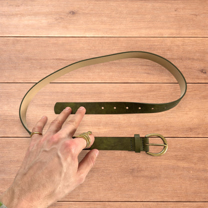 Vintage style faux leather boho cowboy belt in olive green with gold trim.
