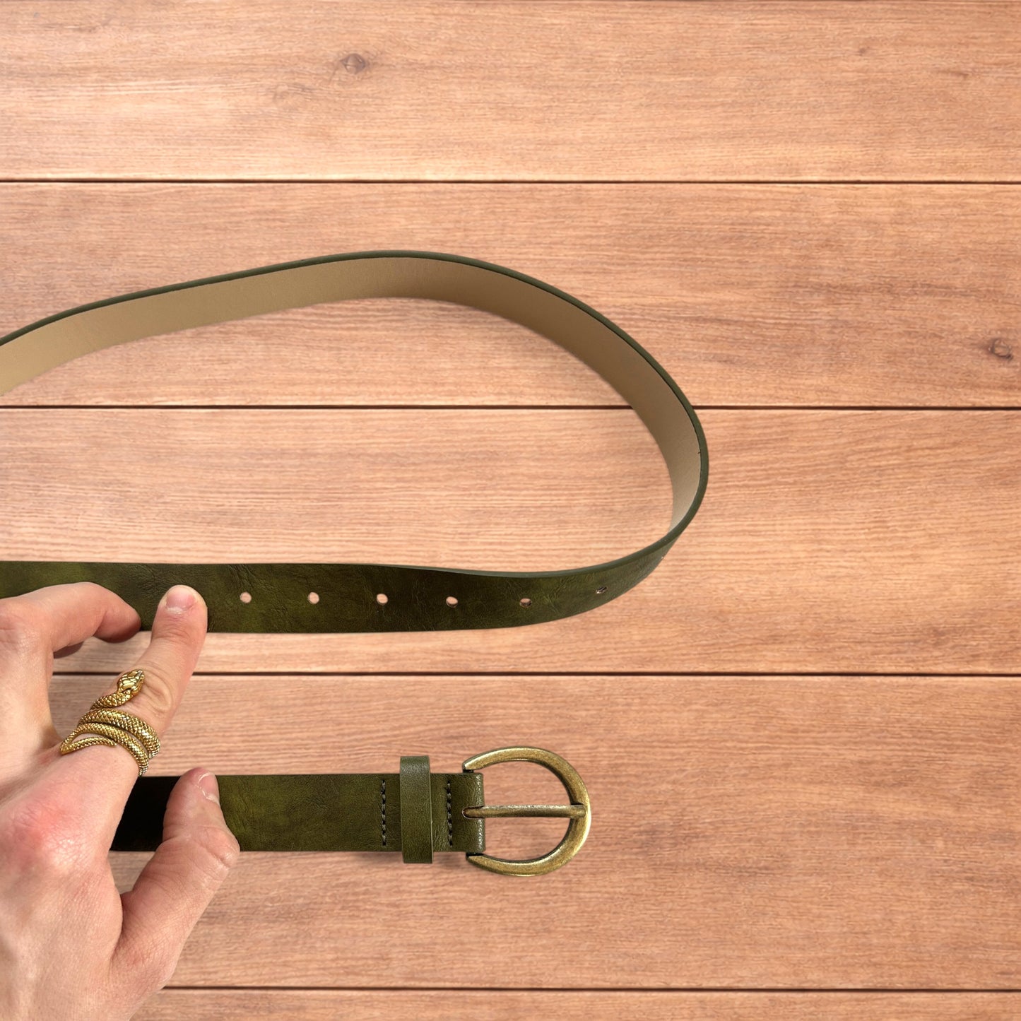 Vintage style faux leather boho cowboy belt in olive green with gold trim.