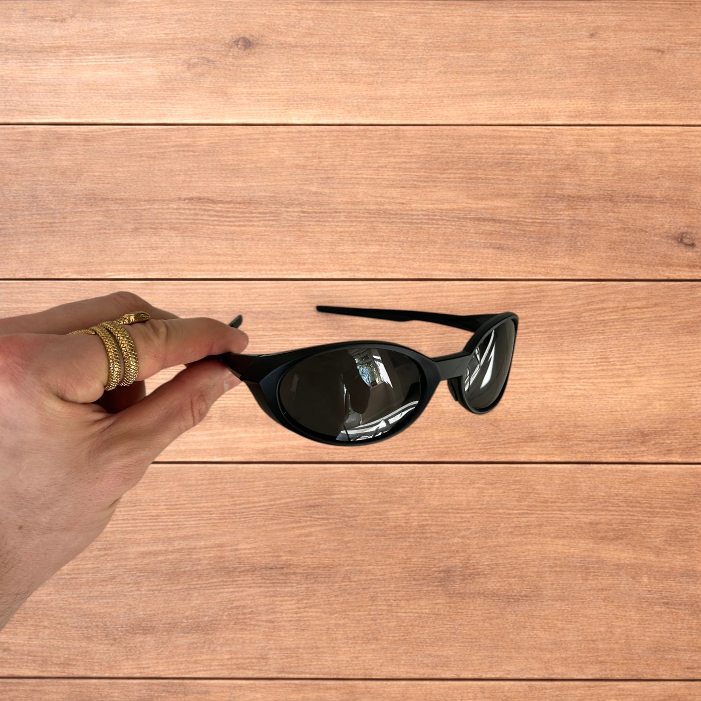 Insane mirrored polarised sunglasses in black with black lense.