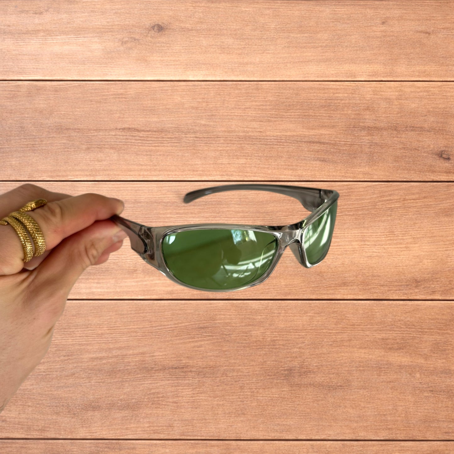 Cool reflective wrap around sunglasses in silver with green lense.