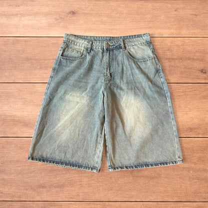 Vintage style baggy wide leg denim shorts jorts with fade in light blue.