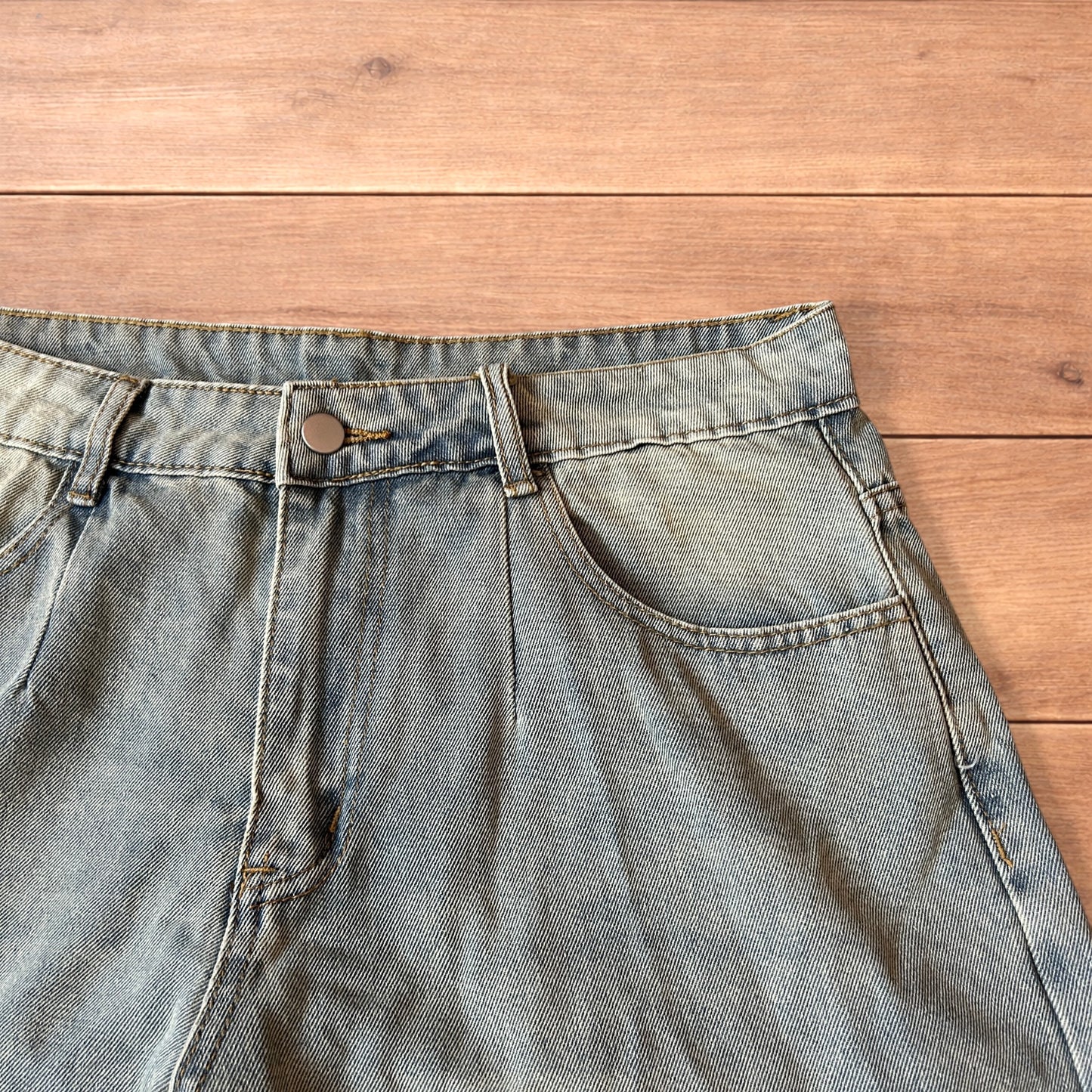 Vintage style baggy wide leg denim shorts jorts with fade in light blue.