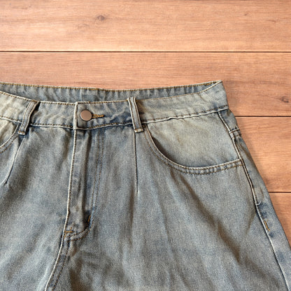 Vintage style baggy wide leg denim shorts jorts with fade in light blue.
