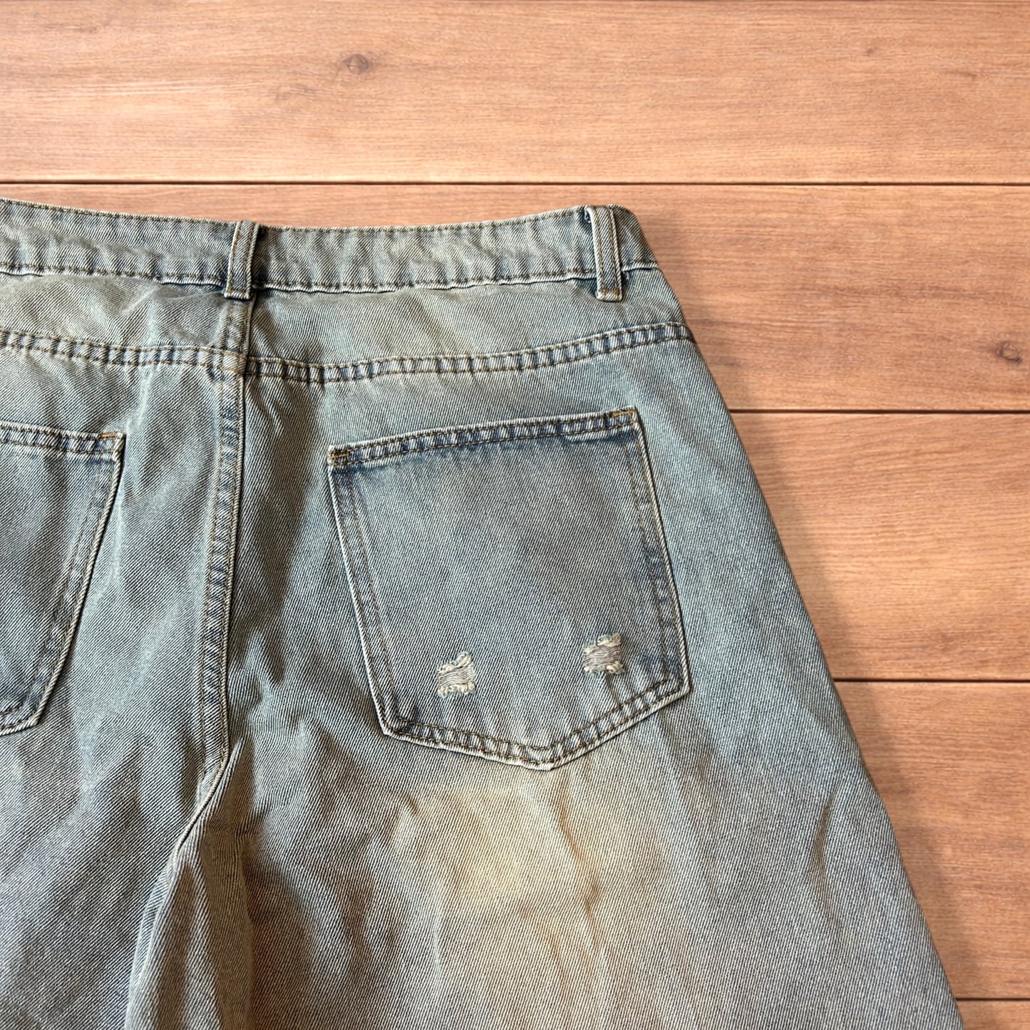 Vintage style baggy wide leg denim shorts jorts with fade in light blue.