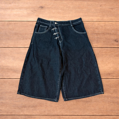 Vintage style baggy wide leg denim shorts jorts with buckles in black.