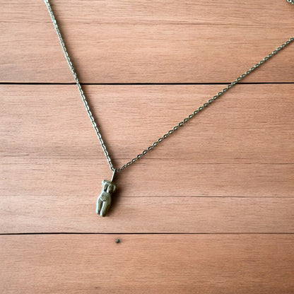 Lovely Gold stainless steel necklace of female woman figure silhouette body.